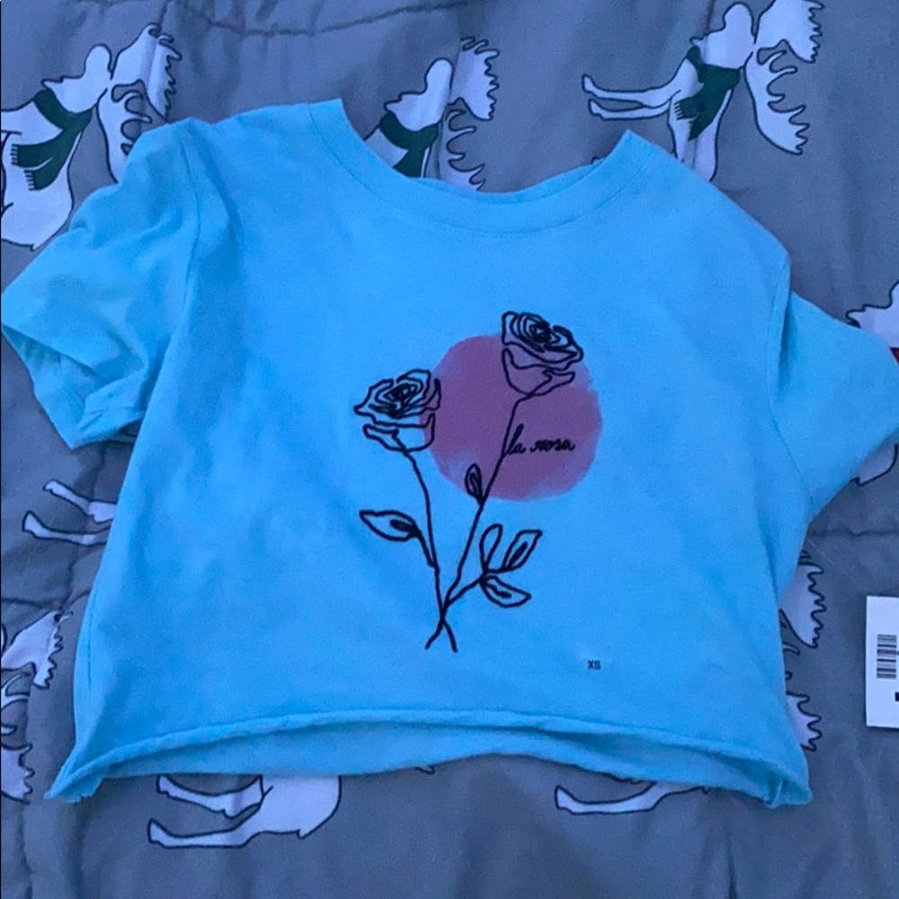 Blue top with flour design